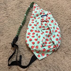KAVU sling bag mini rope.Strawberries with Teal background